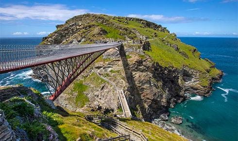 A footbridge stretching out to an island in Cornwall