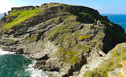 The ruins of Tintagel Castle on a headland in Cornwall