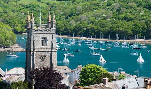 Boats anchored in the harbor in Cornwall