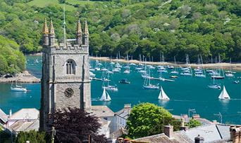 Boats anchored in the harbor in Cornwall