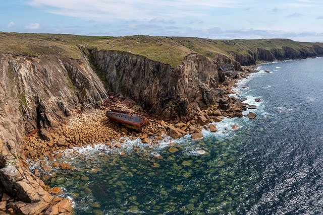 A shipwreck in a cove in Cornwall