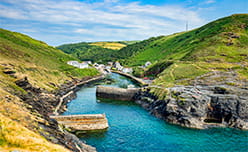 Boscastle Harbour surrounded by green hills
