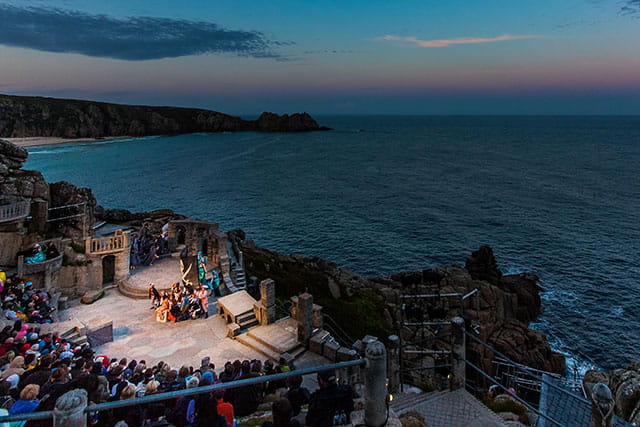 A play at the Minack Theatre in Cornwall at sunset