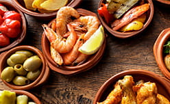 Plates of colourful tapas food