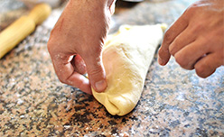 A baker kneading a Cornish pasty