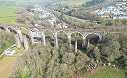 A railway viaduct over a valley in front of the Cornish town of Liskeard
