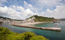 The harbour mouth and beach of Looe in Cornwall