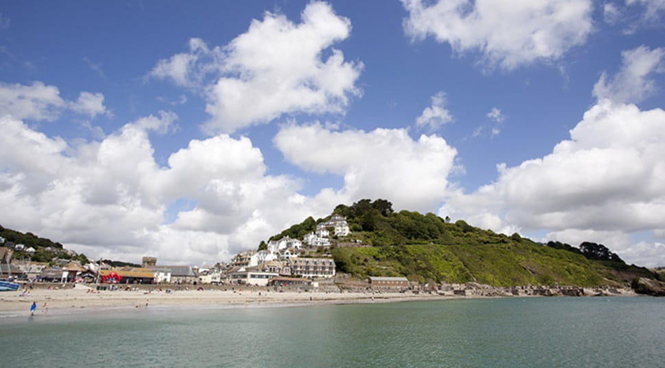 Scenic view of Looe beach and town from out at sea