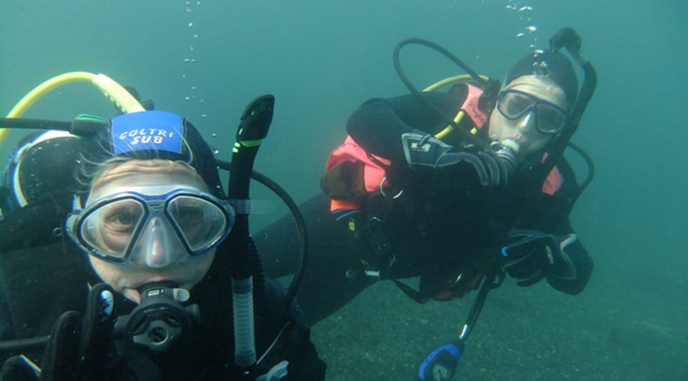 two scuba divers underwater
