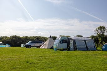 Tents on grass field