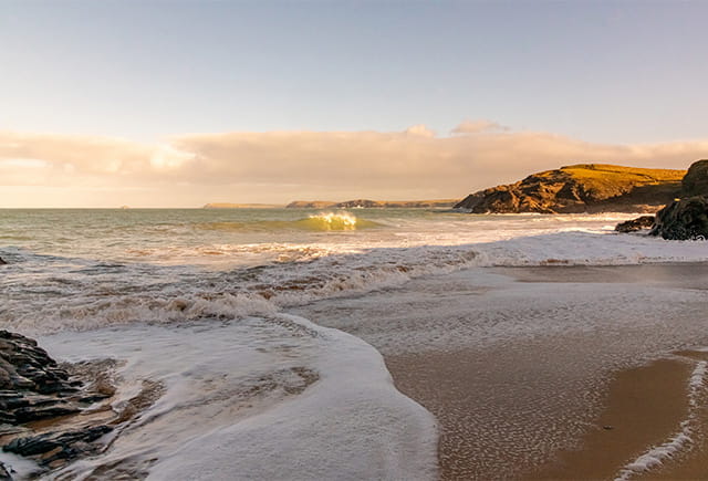 Sunrise over a Cornish beach in spring