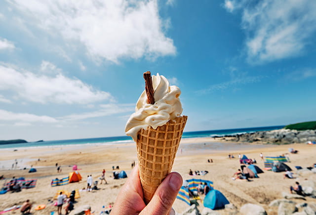 Holding an ice cream at the beach on a summer's day in Cornwall