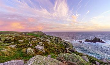 Sunset over a rocky headland in Cornwall