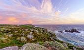 Sunset over a rocky headland in Cornwall