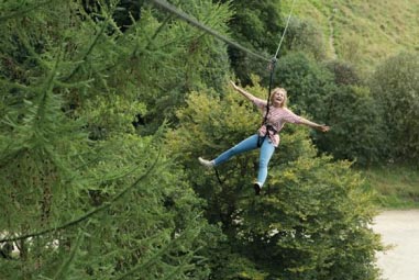 Girl ziplining at Haldon Forest