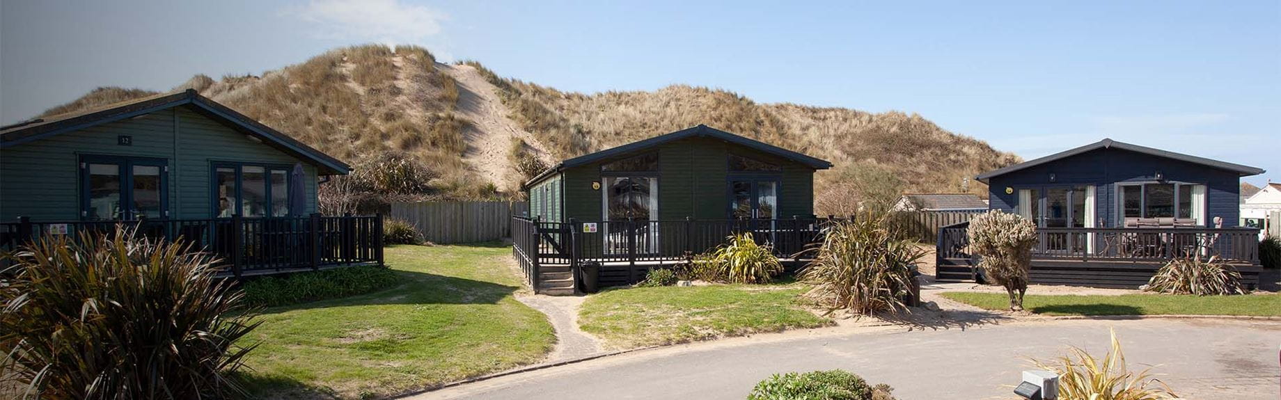 A row of luxury lodges at Ruda Holiday Park in Devon