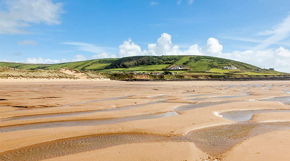 Croyde beach with the tide out on sunny day