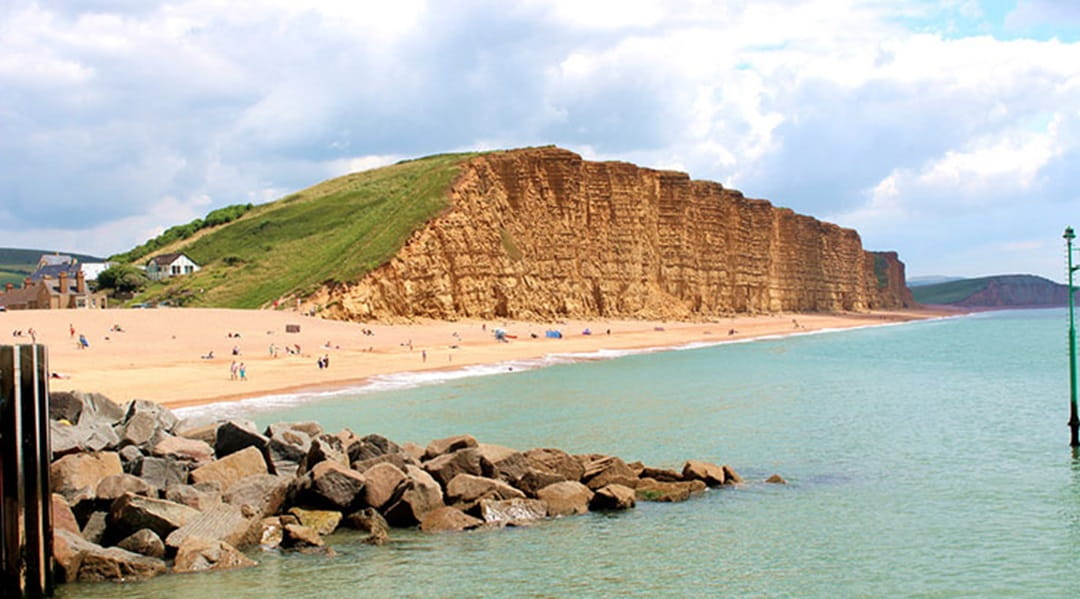 The view over West Bay Beach and cliffs taken from Bridport's pier