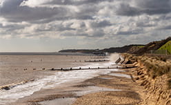 Wooden sea defences lining Gorleston-on-Sea beach on the Norfolk coastline