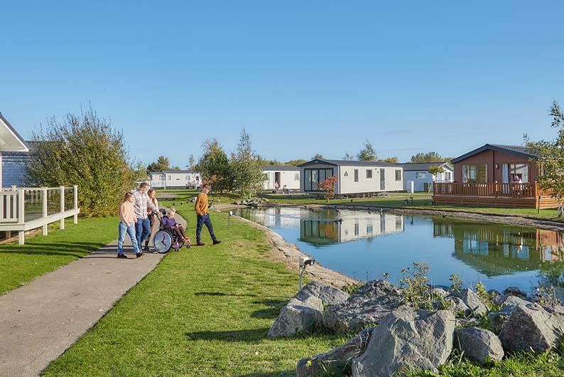 A family exploring Southview Holiday Park's lodges in Skegness