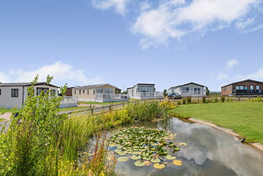 Caravans and lodges at Cherry Tree Holiday Park in Norfolk
