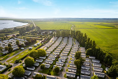 Caravans surrounded by countryside at Vauxhall Holiday Park in Norfolk