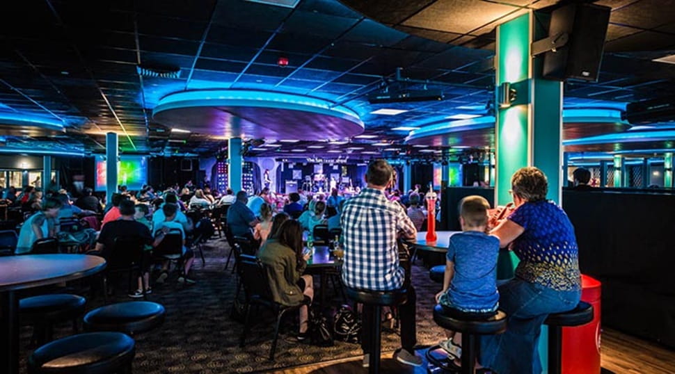 family enjoying live entertainment