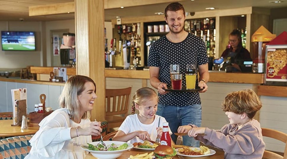family enjoying a meal in the restaurant