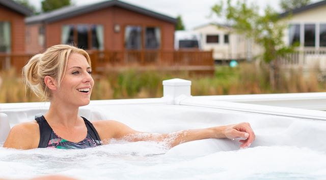 a woman relaxing in a hot tub