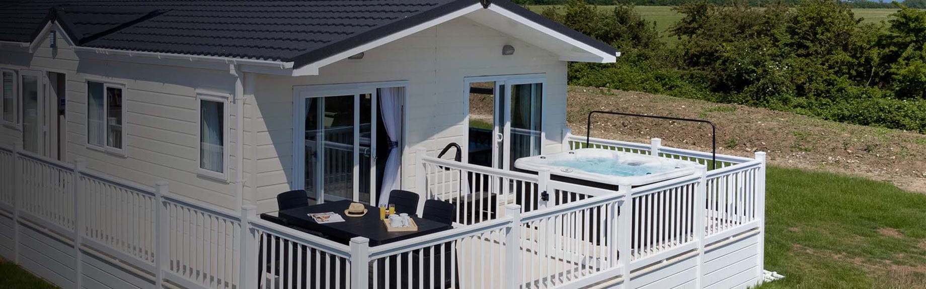 A hot tub lodge at Coopers Beach Holiday Park in Essex