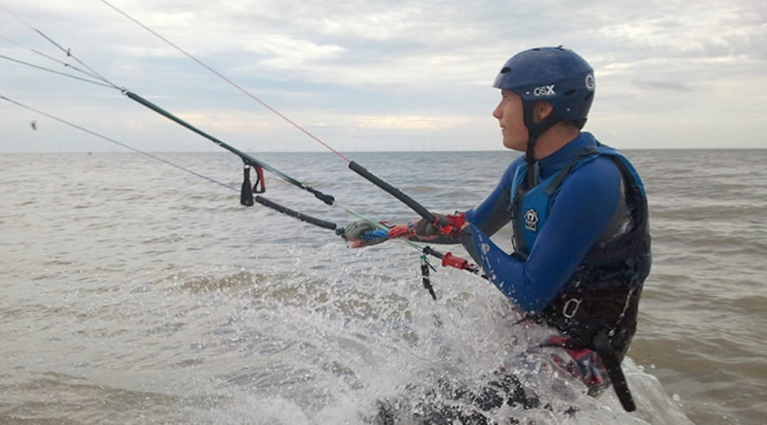 a man kite surfing
