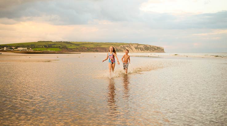 Splashing in the sea on a beach on The Isle of Wight