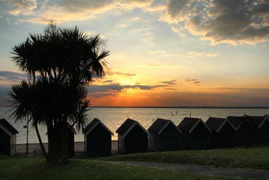 Beach huts at sunset