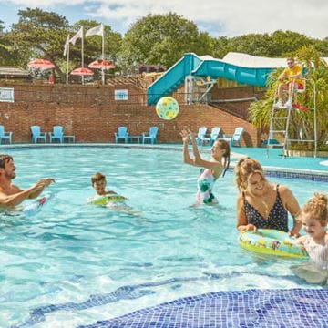 a family playing in a pool