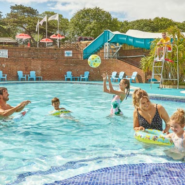 a family playing in a pool