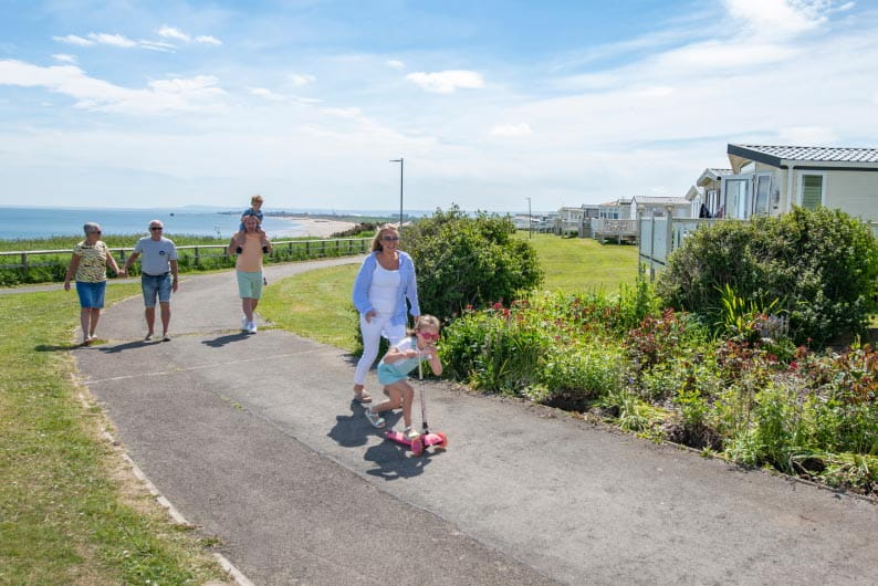 Family walking through Parkdean Resorts