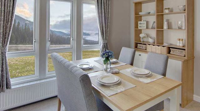 The dining area of a lodge with an outside view