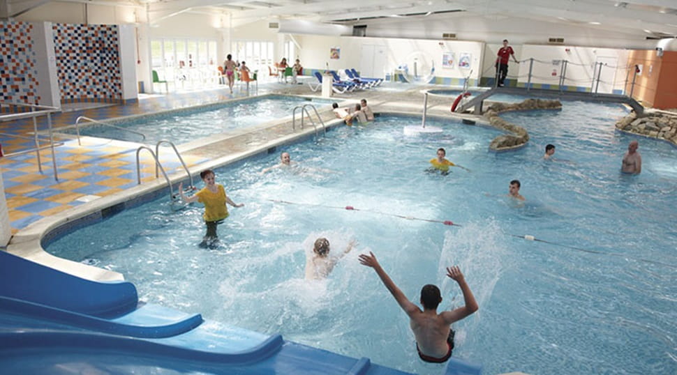 Kids playing in the indoor swimming pool