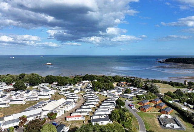 An aerial view over a holiday park on the Isle of Wight's coast