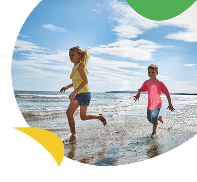 Children running on the beach