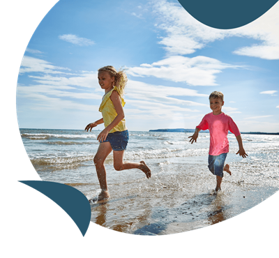 Children running on the beach