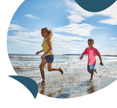 Children running on the beach