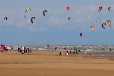 Kids kite surfing at the beach