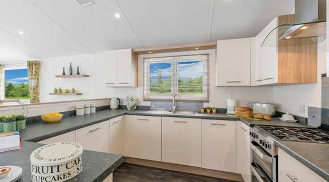 A stylish modern kitchen inside a luxury lodge for sale