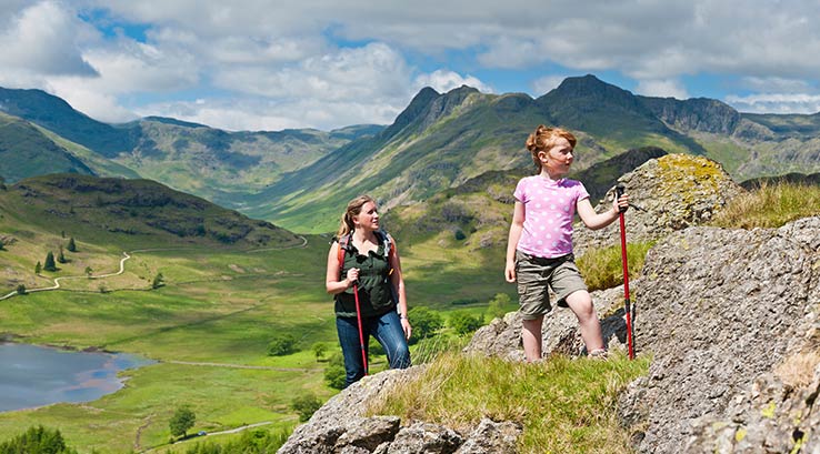 A family hiking over the mountains in the Lake District