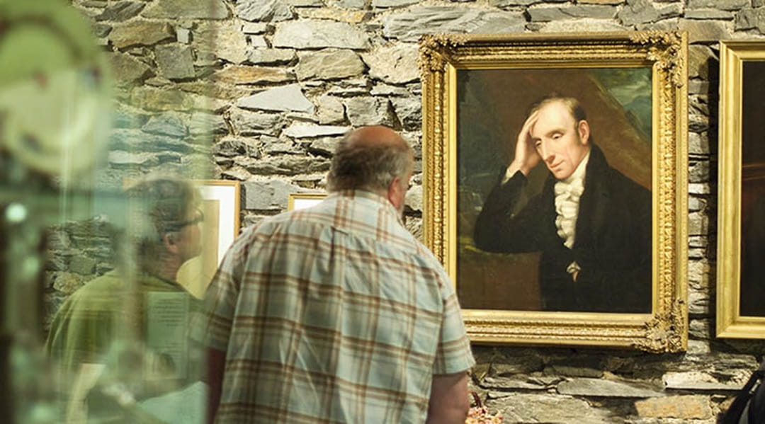 A couple admiring a painting in a gallery