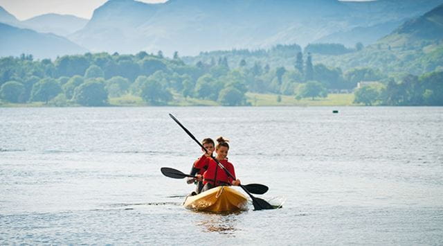 A couple kayaking in the Lake District
