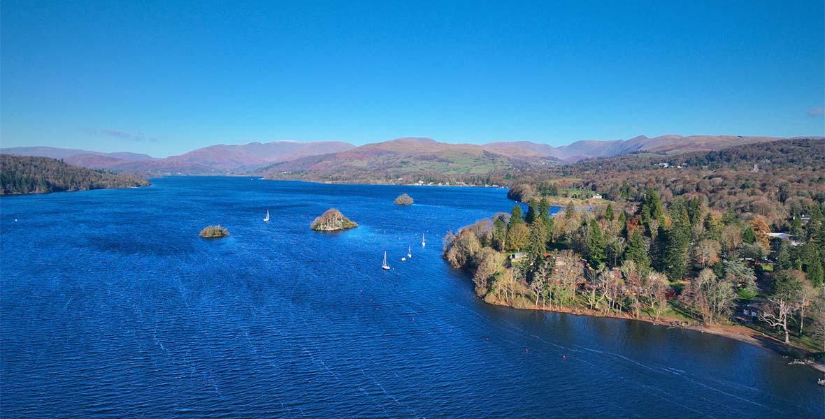 An aerial view over Lake Windermere in the Lake District on a sunny day