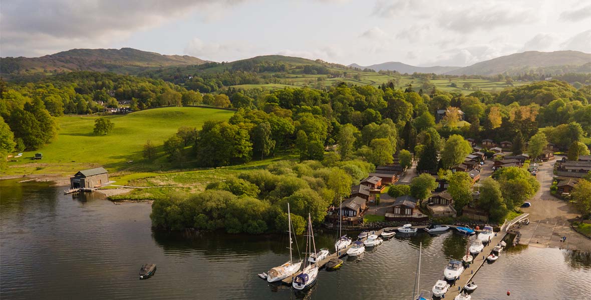 An aerial view of a holiday park and marina on Lake Windermere