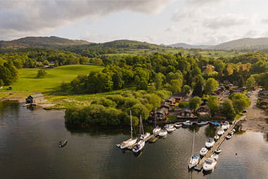 An aerial view of a holiday park and marina on Lake Windermere